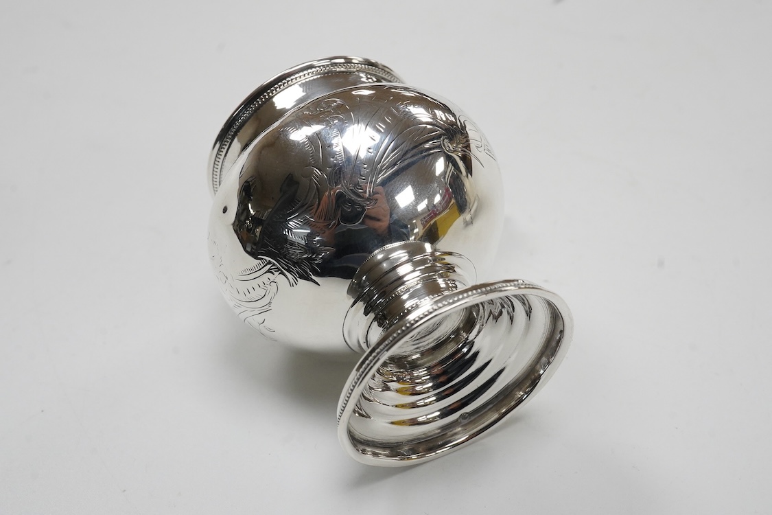 A late 19th/early 20th century Russian 84 zolotnik cream jug, with engraved decoration and angular feet and handle, master Andrei Ivanov, 1908-1917 kokoshnik mark, height 11.6cm, together with a similar single handled sm